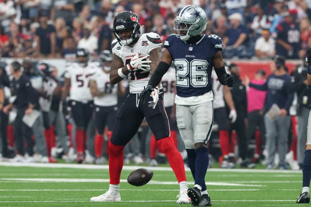 HOUSTON, TX - OCTOBER 04: Wide receiver Nico Collins 12 of the Houston Texans celebrates his first down catch in front of cornerback Daron Bland 26 of the Dallas Cowboys during the NFL, American Football Herren, USA football game between the Houston Texans and Dallas Cowboys on October 4, 2026, at Reliant Stadium in Houston, TX. (Photo by David Buono Icon Sportswire) NFL: OCT 04 Cowboys at Texans EDITORIAL USE ONLY Icon241004023