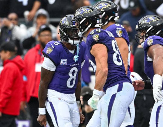 Baltimore Ravens quarterback Lamar Jackson (8) reacts after a 3 yard pass to Baltimore Ravens tight end Mark Andrews (89) against the Tennessee Titans during the second quarter at M&T Bank Stadium in Baltimore, Maryland, on Sunday, October 4, 2026.  BAL20261004104 DAVIDxTULIS