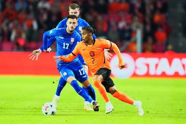 2026-10-04 UEFA Nations League: Netherlands v Serbia EINDHOVEN, NETHERLANDS - OCTOBER 4: Aleksa Terzic of Serbia and Crysencio Summerville of the Netherlands during the UEFA Nations League match between Netherlands and Serbia at Philips Stadion on October 4, 2026 in Eindhoven, Netherlands. Eindhoven Philips Stadion Netherlands Content not available for redistribution in The Netherlands directly or indirectly through any third parties. Copyright: xAndrexWeeningx
