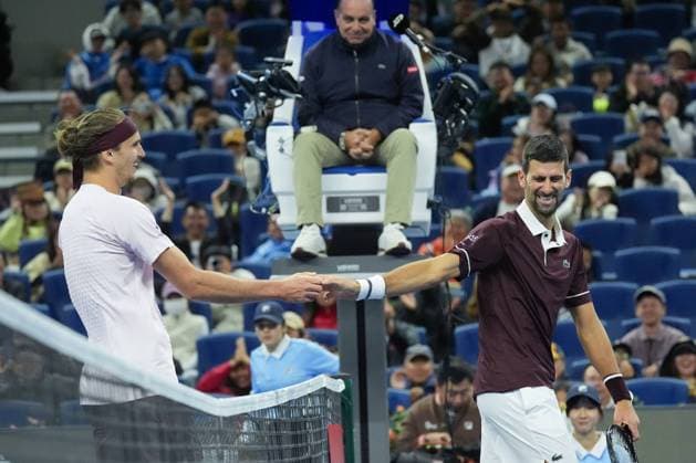 (261004) -- BEIJING, Oct. 4, 2026 -- Alexander Zverev (L) greets with Novak Djokovic after the men s singles quarterfinal match between Alexander Zverev of Germany and Novak Djokovic of Serbia at 2026 China Open tennis tournament in Beijing, China, Oct. 4, 2026. ) (SP)CHINA-BEIJING-TENNIS-CHINA OPEN-MEN S SINGLES(CN) JuxHuanzong 