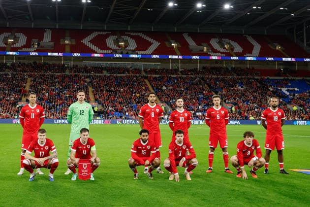 Cardiff, Wales, 4th October 2026. The players of Wales pose for a pre match squad picture ahead of the Wales vs Denmark UEFA Nations League match at the Cardiff City Stadium, Cardiff. Picture credit should read: Cody Froggatt Sportimage EDITORIAL USE ONLY. No use with unauthorised audio, video, data, fixture lists, club league logos or live services. Online in-match use limited to 120 images, no video emulation. No use in betting, games or single club league player publications. SPI_015_CF_WALES_V_DENMARK SPI-5051-0015