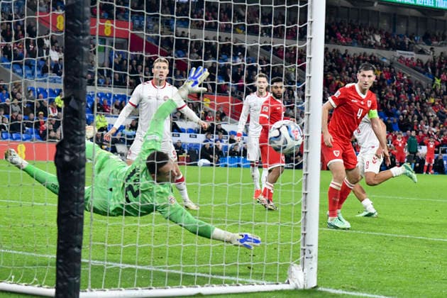 Football - 2026 2027 UEFA Nations League - League A, Group Four: Wales vs. Denmark - Cardiff City Stadium - Sunday 4th October 2026 Danny Ward WALES goalkeeper saves a header from Rasmus Hojlund DENMARK colorsport winston bynorth 