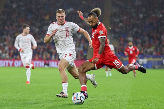 Wales v Denmark UEFA Nations League Sorba Thomas of Wales crosses the ball with pressure from Rasmus Kristensen of Denmark during the UEFA Nations League match at the Cardiff City Stadium, Cardiff 04 10 2026 UK Newspapers OUT Copyright: xKaraxThomasx FIL-24028-0042