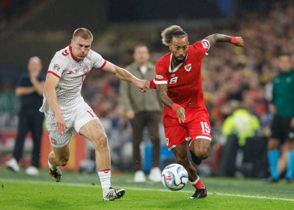 Cardiff, Wales, 4th October 2026. Sorba Thomas of Wales holds off a challenge from Rasmus Kristensen of Denmark during the Wales vs Denmark UEFA Nations League match at the Cardiff City Stadium, Cardiff. Picture credit should read: Cody Froggatt Sportimage EDITORIAL USE ONLY. No use with unauthorised audio, video, data, fixture lists, club league logos or live services. Online in-match use limited to 120 images, no video emulation. No use in betting, games or single club league player publications. SPI_033_CF_WALES_V_DENMARK SPI-5051-0033