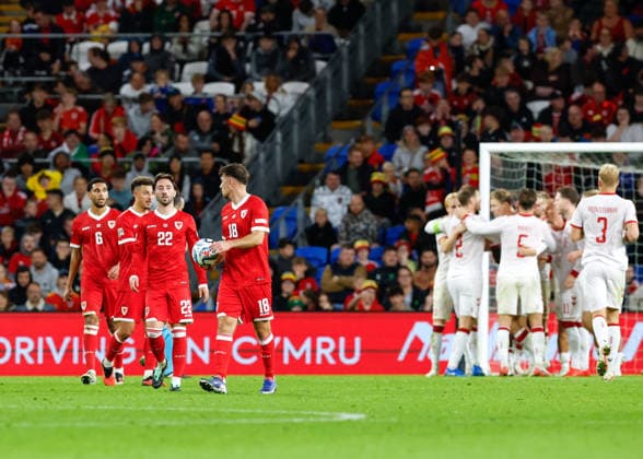 Cardiff, Wales, 4th October 2026. The players of Wales react after conceding their first goal during the Wales vs Denmark UEFA Nations League match at the Cardiff City Stadium, Cardiff. Picture credit should read: Cody Froggatt Sportimage EDITORIAL USE ONLY. No use with unauthorised audio, video, data, fixture lists, club league logos or live services. Online in-match use limited to 120 images, no video emulation. No use in betting, games or single club league player publications. SPI_039_CF_WALES_V_DENMARK SPI-5051-0039