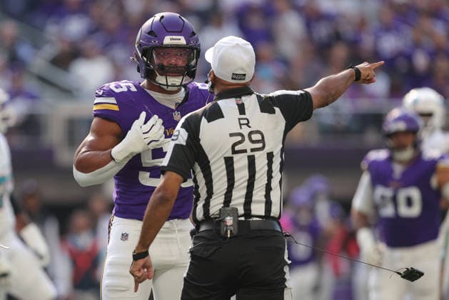 MINNEAPOLIS, MN - OCTOBER 04: Minnesota Vikings linebacker Eric Wilson (55) talks with referee Adrian Hill (29) during the first half of the NFL, American Football Herren, USA game between the Miami Dolphins and the Minnesota Vikings on October 4th, 2026, at U.S. Bank Stadium in Minneapolis, MN. (Photo by Bailey Hillesheim Icon Sportswire) NFL: OCT 04 Dolphins at Vikings EDITORIAL USE ONLY Icon20261004015