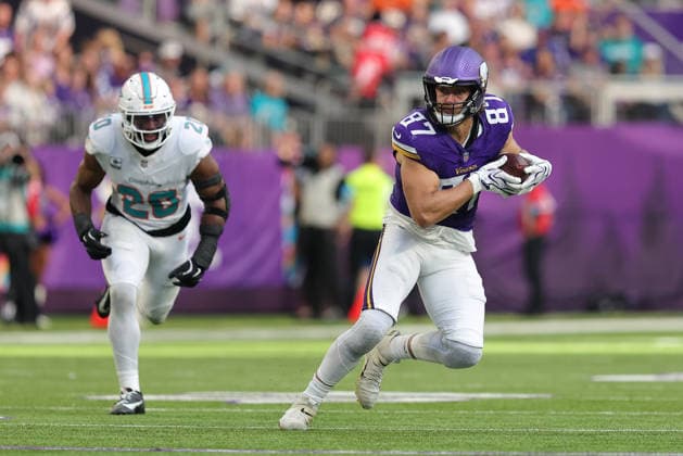 MINNEAPOLIS, MN - OCTOBER 04: Minnesota Vikings tight end T.J. Hockenson (87) runs with the ball while Miami Dolphins linebacker Jordyn Brooks (20) defends during the first half of the NFL, American Football Herren, USA game between the Miami Dolphins and the Minnesota Vikings on October 4th, 2026, at U.S. Bank Stadium in Minneapolis, MN. (Photo by Bailey Hillesheim Icon Sportswire) NFL: OCT 04 Dolphins at Vikings EDITORIAL USE ONLY Icon20261004033