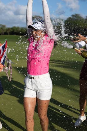 October 4, 2026, Honolulu, Hawaii, USA: Friends pour champagne on JEENO THITIKUL after she won the 2026 Lotte Championship at Hoakalei Country Club, Ewa Beach, Hawaii, USA. Honolulu USA - ZUMAm310 20261004_zsp_m310_062 Copyright: xElliotxMilesx
