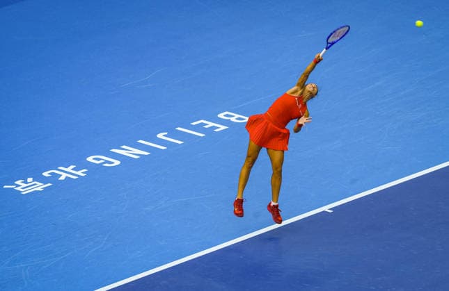 (261005) -- BEIJING, Oct. 5, 2026 -- Zheng Qinwen of China serves during the women s singles round of 32 match against Marie Bouzkova of the Czech Republic at 2026 China Open tennis tournament in Beijing, China, Oct. 5, 2026. ) (SP)CHINA-BEIJING-TENNIS-CHINA OPEN-WOMEN S SINGLES(CN) SunxFei 