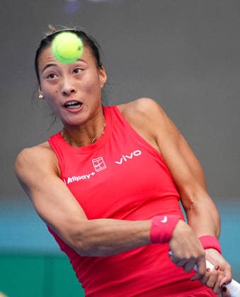 (261005) -- BEIJING, Oct. 5, 2026 -- Zheng Qinwen of China hits a return during the women s singles round of 32 match against Marie Bouzkova of the Czech Republic at 2026 China Open tennis tournament in Beijing, China, Oct. 5, 2026. ) (SP)CHINA-BEIJING-TENNIS-CHINA OPEN-WOMEN S SINGLES(CN) SunxFei 