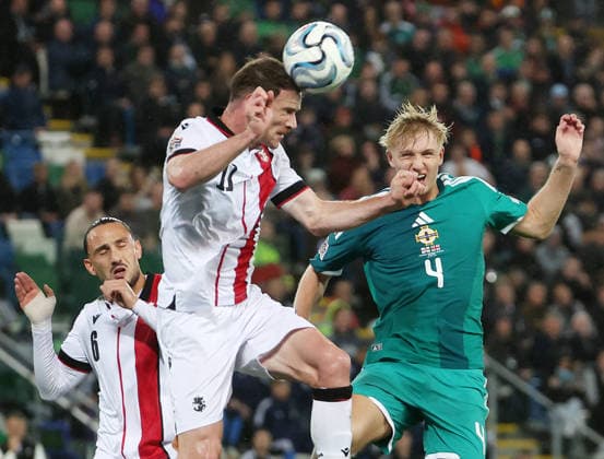 UEFA Nations League Group Stage Northern Ireland vs Georgia 5 10 2026 Northern Ireland™s Tom Atcheson with Georgia™s Budu Zivzivadze and Giorgi Kochorashvili Tom Atcheson with Budu Zivzivadze and Giorgi Kochorashvili 5 10 2026  Copyright: xx 051026JP2football007