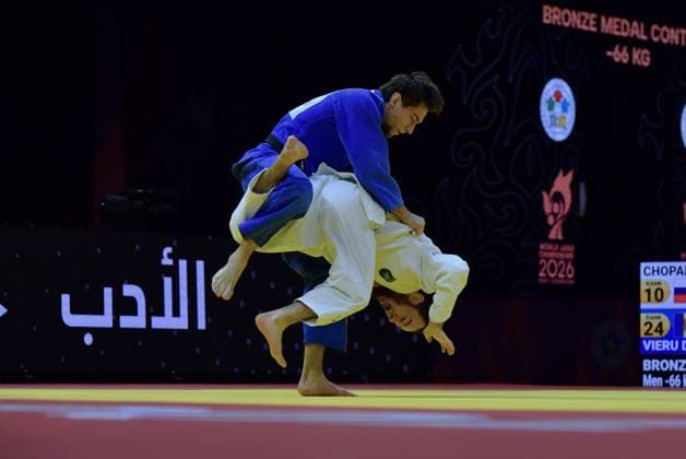 (261006) -- BAKU, Oct. 6, 2026 -- Denis Vieru (top) of Moldova competes against Murad Chopanov of Russia during the men s 66kg bronze medal match at the World Judo Championships 2026 in Baku, Azerbaijan, Oct. 5, 2026. ) (SP)AZERBAIJAN-BAKU-WORLD CHAMPIONSHIPS 2026-MEN S 66KG ChenxJunfeng 