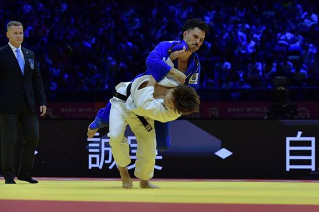 (261006) -- BAKU, Oct. 6, 2026 -- Abe Hifumi (below) of Japan competes against David Garcia Torne of Spain during the men s 66kg gold medal match at the World Judo Championships 2026 in Baku, Azerbaijan, Oct. 5, 2026. ) (SP)AZERBAIJAN-BAKU-WORLD CHAMPIONSHIPS 2026-MEN S 66KG ChenxJunfeng 