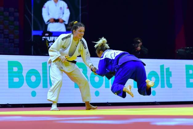 (261006) -- BAKU, Oct. 6, 2026 -- Mascha Ballhaus (L) of Germany competes against Odette Giuffrida of Italy during the women s 52kg bronze medal match at the World Judo Championships 2026 in Baku, Azerbaijan, Oct. 5, 2026. ) (SP)AZERBAIJAN-BAKU-WORLD CHAMPIONSHIPS 2026-WOMEN S 52KG ChenxJunfeng 