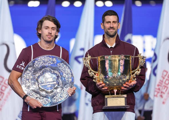(261006) -- BEIJING, Oct. 6, 2026 -- Winner Novak Djokovic (R) of Serbia and runner-up Alex de Minaur of Australia pose for photos during the awarding ceremony for the men s singles final at 2026 China Open tennis tournament in Beijing, China, Oct. 6, 2026. ) (SP)CHINA-BEIJING-TENNIS-CHINA OPEN-MEN S SINGLES-AWARDING CEREMONY(CN) BaixXuefei 