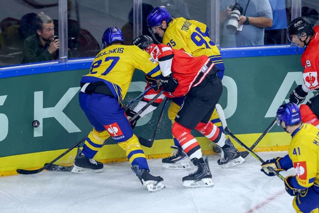 October 7, 2026, Ice Hockey, CHL, Kölner Haie vs. Blue Fox Herning, Champions Hockey League 2026–27, Matchday 5, 2026–27 Season, Lanxess Arena, Cologne: Marco Münzenberger of the Kölner Haie 65 battles Oskars Cibulskis of Blue Fox Herning 27 and Artturi Mikael Toivola of Blue Fox Herning 95; North Rhine-Westphalia, Germany