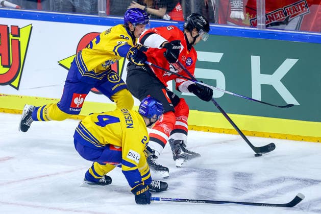 October 7, 2026, Ice Hockey, CHL, Kölner Haie vs. Blue Fox Herning, Champions Hockey League 2026–27, Matchday 5, 2026–27 Season, Lanxess Arena, Cologne: Louis Marc Aubry of the Kölner Haie (No. 15) battles Valdemar Bilgrav (No. 26) and Lasse Baerentsen (No. 24) of Blue Fox Herning; North Rhine-Westphalia, Germany