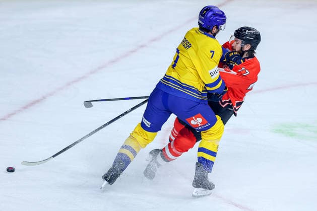 October 7, 2026, Ice Hockey, CHL, Kölner Haie vs. Blue Fox Herning, Champions Hockey League 2026–27, Matchday 5, 2026–27 Season, Lanxess Arena, Cologne: John Terrance Amorosa of Blue Fox Herning No. 07 battles Ryan MacInnis of the Kölner Haie No. 77, North Rhine-Westphalia, Germany