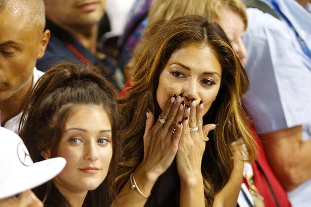 Motorsport, Formula 1, Nicole Scherzinger celebrates victory with Lewis Hamilton at Abu Dhabi GP