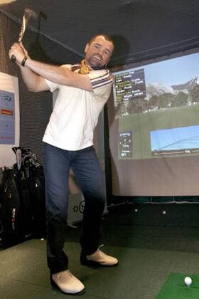 Falko Götz, Dieter Hoeneß and Sven Ottke try out a golf simulator in Nike Town