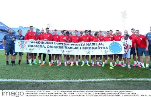 Football, Croatia's national team with a poster against racism, discrimination and poverty