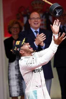 Formula 1, Monaco GP, Lewis Hamilton throws the trophy in the air at the victory ceremony