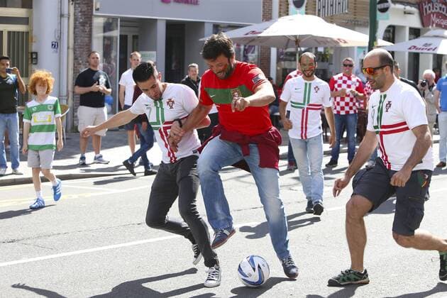 EURO 2016, Portuguese fans play football in the street in Lens city centre