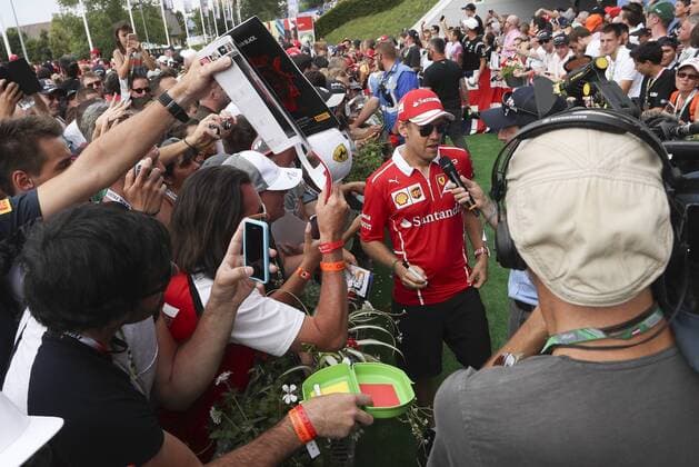 Formula 1, Austrian GP, Sebastian Vettel signs autographs