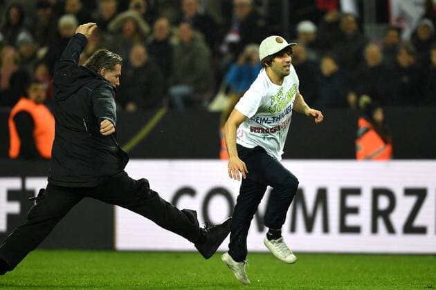 Football, international match, Germany - France, streaker creates run across the pitch