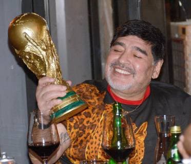 Football, Diego Maradona with replica of World Cup trophy at event in Mexico