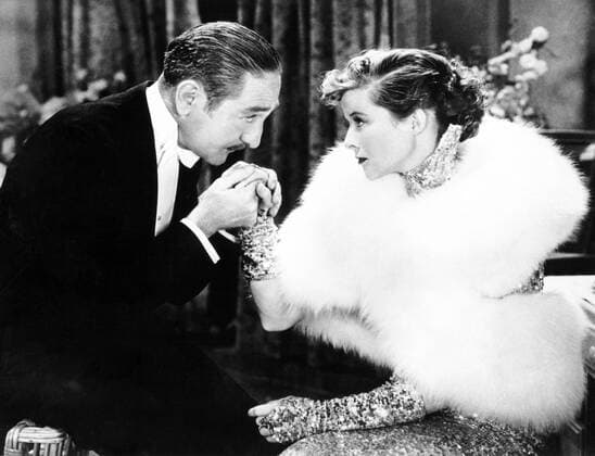 OSCARS. Beste Hauptdarstellerin. Preisträgerinnen 1931-1940 Schauspielerin Katharine Hepburn (USA) mit Adolphe Menjou (USA) während der Dreharbeiten zum Film - Morning Glory -  (arc20063009)