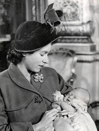 Dec 16, 1948 - London, England, UK - The elder daughter of King George VI and Queen Elizabeth, ELIZABETH WINDSOR (named Elizabeth II) became Queen at the age of 25, and has reigned through more than five decades of enormous social change and development. For more than 50 years, during a period of great social change, The Queen has carried out her political duties as Head of State, the ceremonial responsibilities of the Sovereign and an unprecedented programme of visits in the United Kingdom, Commonwealth and overseas. PICTURED: QUEEN ELIZABETH II holding PRINCE CHARLES. London UK  - ZUMAk09