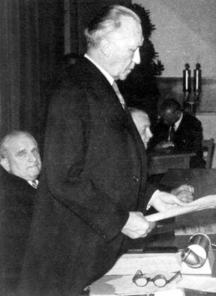 May 23, 1949 - Bonn, Germany - West Germany s first chancellor KONRAD ADENAUER began his career in politics as a member of the Cologne City Council, becoming lord mayor of the city. After the Nazis came to power in 1933, Adenauer, who had not hidden distaste for them, lost his positions, was forced to go into exile for a year in an abbey and was later interned in a prison camp. Adenauer was elected Chancellor of the Federal Republic of Germany on 15 September 1949. His main aim was to ensure West Germany s transition to a sovereign, democratic state. He held power for the next fourteen years and during that time played an important role in restoring good relations with France and the United States. PICTURED: Passage of Basic Law for the Federal Republic of Germany; KONRAD ADENAUER giving a speech, his proxy, ADOLF SCHOENFELDER in the background. Bonn Germany  - ZUMAk09