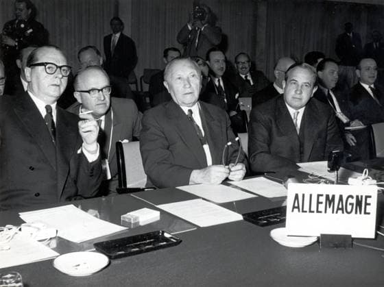 May 02, 1957 - Bonn, Germany - West Germany s first chancellor KONRAD ADENAUER began his career in politics as a member of the Cologne City Council, becoming lord mayor of the city. After the Nazis came to power in 1933, Adenauer, who had not hidden distaste for them, lost his positions, was forced to go into exile for a year in an abbey and was later interned in a prison camp. Adenauer was elected Chancellor of the Federal Republic of Germany on 15 September 1949. His main aim was to ensure West Germany s transition to a sovereign, democratic state. He held power for the next fourteen years and during that time played an important role in restoring good relations with France and the United States. PICTURED: Secretary of State HEINRICH VON BRENTANO, Under-Secretary of State WALTER HALLSTEIN, KONRAD ADENAUER and NATO ambassador HERBERT BLANKENHORN durnig a NATO conference. Bonn German  - ZUMAk09