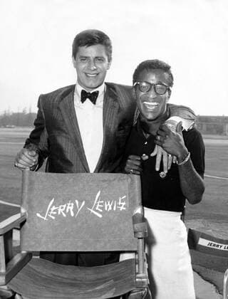 Jan 01, 1958 - Los Angeles, CA, USA - Perhaps no popular film artist in history inspired quite so many conflicting opinions and emotions as actor comedian JERRY LEWIS. Often reviled in his native United States but worshipped as a genius throughout much of Europe and especially France, Lewis took slapstick comedy to new realms of absurdity and outrageousness, his anarchic vision dividing audiences who found him infantile and witless from those who applauded the ambitions of his sight gags, his subversions of standard comedic patterns, and his films acute criticisms of American values. Pictured with SAMMY DAVIS JR. during shooting of The Geisha Boy. (Image Date And Location Unknown) Los Angeles USA  - ZUMAk09