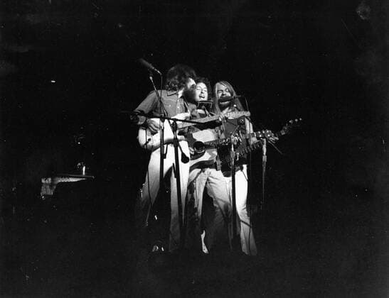 Bob Dylan (C) and George Harrison, Concert for Bangladesh, New York - GEORGE HARRISON (25 February 1943 - 29 November 2001) was an Academy Award and Grammy Award-winning English rock guitarist, singer, songwriter, author and sitarist best known as the lead guitarist of The Beatles. Following the band s demise, Harrison had a successful career as a solo artist and was also a film producer, with his production company Handmade Films, involving people as diverse as Madonna and the members of Monty Python. From an initial exposure whilst a member of The Beatles, he maintained a high public profile regarding his religious and spiritual life London UK  - ZUMAk09