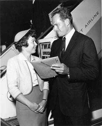 Oct 06, 1961; New York, NY, USA; Actor CHARLTON HESTON known for his religious roles in Ben-Hur and The Ten Commandments , with TWA hostess PAT SELZ as he arrived in New York. New York USA  - ZUMAk09