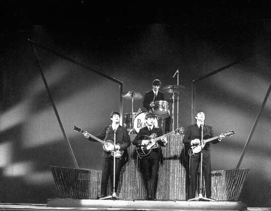 Oct 14, 1963; London, UK; The Liverpool group THE BEATLES starred at the London Palladium to the accompaniment of about 2,000 screaming teenage girls who had besieged the theatre all day long. The picture shows, The Beatles, on the stage at the London Palladium during their performance. From left to right, PAUL McCARTNEY, GEORGE HARRISON, RINGO STARR (drums) and JOHN LENNON. London UK  - ZUMAk09