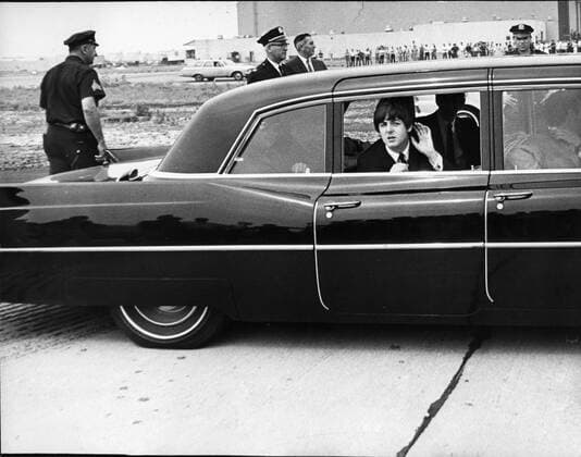 Aug 13, 1965; London, England, UK; Singer, Songwriter, PAUL MCCARTNEY member of the famous pop group The Beatles listening to the shouts of the fans as they arrive in New York. London UK  - ZUMAk09