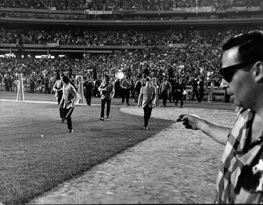 Aug 15, 1965; New York, NY, USA; Never before entertainers used a stadium which normally holds 60,000 plus sportsfans, but when the BEATLES went to America only the largest stage available would do, so they hired the Shea Stadium in New York. And they filled it right up to every available seat. New York USA  - ZUMAk09