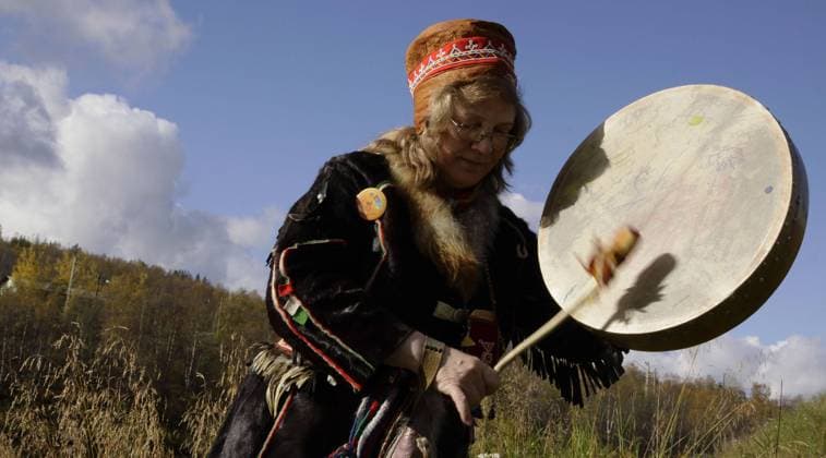 Sep 12, 2009 - Murmansk, Russian Federation - The village of Lappish (Murmansk region) played host to the XIII traditional Sami national games. The fest program includes sport national competition for the Women s Sami football, lassoing deer, jumping over sledges, firing a crossbow, fishing as well as amateur performances of folklore groups of the Murmansk region. In the games attended by the Sami of the Kola region, Lovozero, Kovdor and Murmansk. Everyone could taste the Sami national dishes. Female shaman, the spiritual leader of the Kola Saami. Murmansk Russian Federation - ZUMApr2