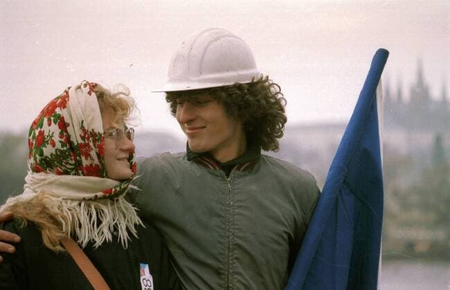 Velvet Revolution, Prague, Czechoslovakia, November 1989. Two citizens, female student with worker demonstrate for the change of the government at Wenceslas Square. The anger with the Communist government escalated after a brutal police crack down on students on November 17th at the National Boulevard. 