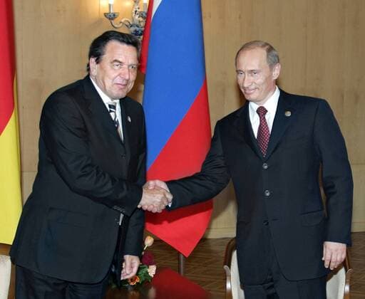 Russian President Vladimir Putin, right, shakes hands with German Chancellor Gerhard SchrÃ¶der during their meeting in Moscow, Monday, May 9, 2005.  TASS_156687