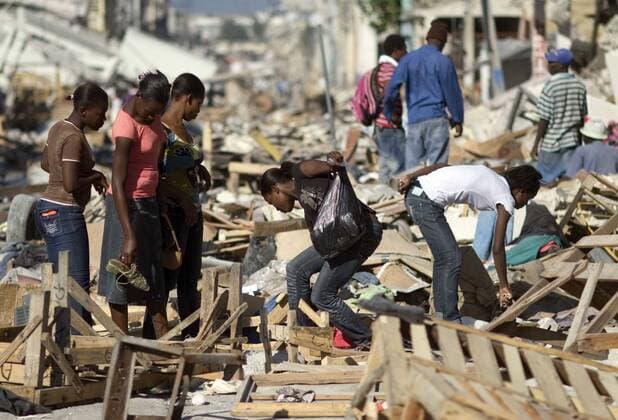 (100116) -- PORT-AU-PRINCE, Jan. 16, 2010 (Xinhua) -- Residents search among debris of houses in Port-au-Prince, capital of Haiti, Jan. 15, 2010. The 7.3-magnitude temblor on Jan. 12 has dealt a hard blow to the small Caribbean nation of Haiti.(Xinhua David de la Paz) (msq) (1)HAITI-EARTHQUAKE-AFTERMATH 