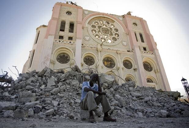 (100124) -- PORT-AU-PRINCE, Jan. 24, 2010 (Xinhua) -- A man reacts sadly in front of damaged cathedral in Port-au-Prince, Haiti, Jan. 23, 2010. The Haitian government said Friday that the number of people killed in last week s devastating earthquake has surpassed 110,000. (Xinhua David de la Pas)(dyw) (5)HAITI-PORT-AU-PRINCE-QUAKE 