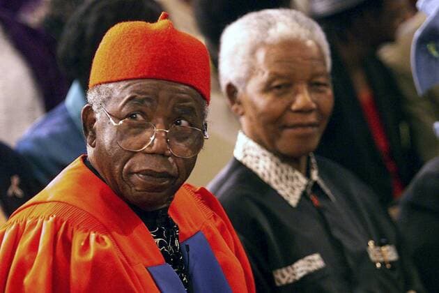 5 December 2005. Professor Chinua Achebe (L), Nigerian author, recieves an honourary doctorate at the University of Cape Town. Behind him is former South African president Nelson Mandela. Gallo000016054