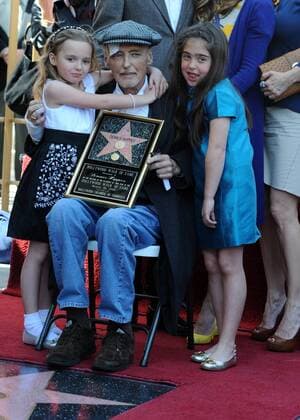 Actor Dennis Hopper is hugged by his daughter Galen (L) and his granddaughter Violet Goldstone at a ceremony where he was honored with the 2,403rd star on the Hollywood Walk of Fame in Los Angeles on March 26, 2010. Hopper was surrounded by a bevy of screen legends turning out to honor him as he battles prostate cancer.  LAP2010032605
