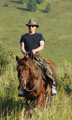 TAS 34. ALTAI TERRITORY,RUSSIA. SEPTEMBER 2. President Vladimir Putin pictured travelling on horseback during his vacation in the Altai area on August 22. . ( File Photo ITAR-TASS of August 22,2003)  TASS_99248