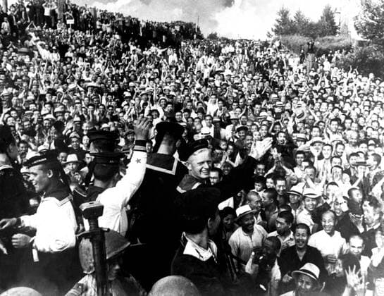 Great Patriotic War in photography . Manchuria. 1945. Soviet sailors are greeted in Haerbin. Reproduction.  TASS_190922