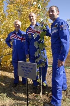 ITAR-TASS 13: BAIKONUR, KAZAKHSTAN. OCTOBER 8. Space flight participant, multi-millionaire US businessman, Richard Garriott (C), flanked by his back-up, Australian multi-millionaire, Nik Halik (R), and US astronaut Owen Garriott posing for the camera after planting a maple tree on the Walk of Cosmonauts (Alleya Kosmonavtov), at Baikonur Cosmodrome, Kazakhstan. Garriott and the ISS Expedition 18 crew members are due to be launched aboard the Soyuz TMA-13 spacecraft on October 12, 2008.  695098